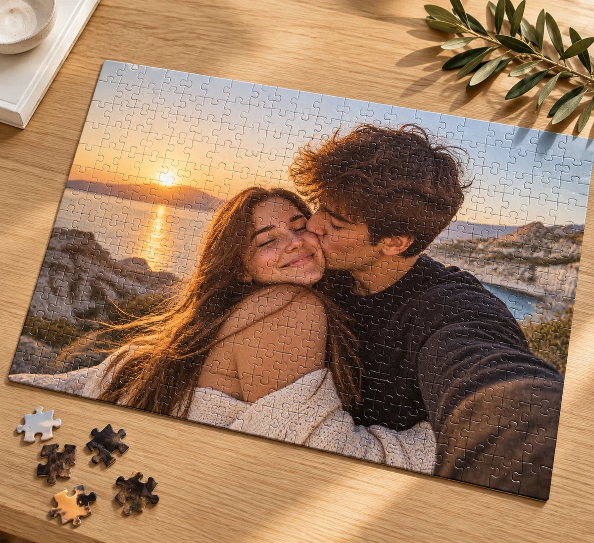 Completed sunset couple photo puzzle on a wooden table